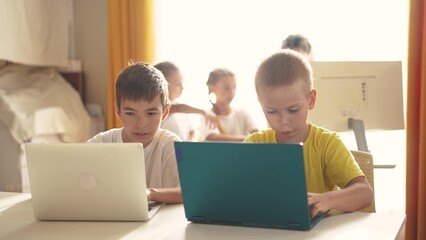 group of children study at home via laptops. business concept of modern training and development. li