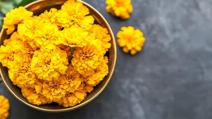 Poster - A bowl of yellow flowers sits on a dark surface