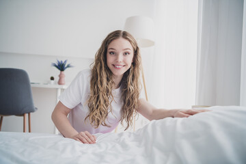 Sticker - Full body photo of sweet pretty teen girl cheerful making bed morning routine wear pajama white interior bedroom apartment