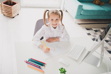 Wall Mural - Photo portrait of cute small schoolgirl drawing pencils inspiration idea home education concept school interior