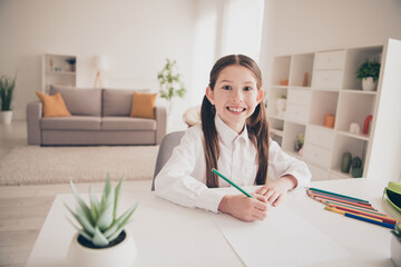 Poster - Photo portrait of cute small schoolgirl drawing pencils idea cheerful home education concept school interior