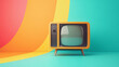 © ChristacilinCreative - A vintage yellow tv against a colorful retro background wall