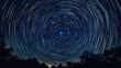 © 69 - Star trails forming concentric circles around the North Star, set against a dark, starry night sky, highlighting the rotation of the Earth.