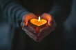 © Vlad - Burning Candle Held by Hands in Dark with Selective Focus on Heart Shape Glow