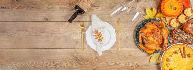 Traditional Thanksgiving dinner on wood banner background copy space. Turkey, pumpkin pie and wine