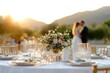 © Arpatsara - A romantic wedding setting at sunset, featuring elegant table decor and a couple in the background, perfect for celebration themes.