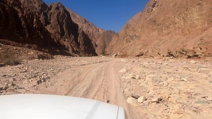 Wall Mural - Footage of a car ride in the mountains on sunny evening. Dahab, Egypt.