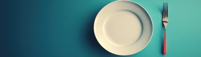 Elegant table setting with a white plate and fork on a turquoise background, ideal for dining, restaurant, and food presentation visuals.