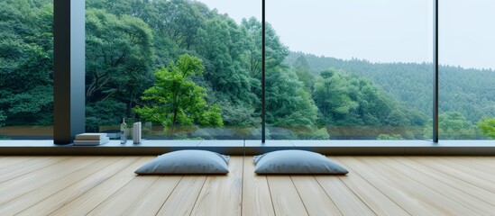 Photo of a minimalist wooden terrace with two grey pillows and books, overlooking the forest landscape