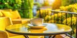 © Udomner - Cup of coffee sitting on a vibrant yellow table on a summer terrace, coffee, cup, yellow, table, terrace, summer