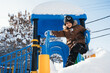 © alexkoral - happy child boy is playing on a playground on a slide outside in winter.