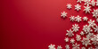 © Iriyalo - Group of white snowflakes on a red background, symbolizing the festive and cold winter season