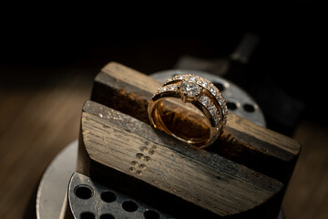 Wall Mural - The work of jewelers. Trial jewelry of semiprecious metals. Ring. Selective focus. Macro photo.