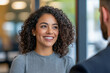© Pompozzi - Smiling Woman in Business Setting