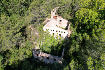 Remains of a hydroelectric power station on sunny summer day. Alcover, Tarragona, Spain.