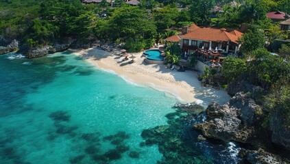 Wall Mural - Tropical resort with clear water and a beach.