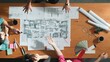 © Summit Art Creations - Top view of smart architect engineer team talking about project plan while manager walking at meeting table and start working and analyze building construction and looking at blueprint. Symposium.
