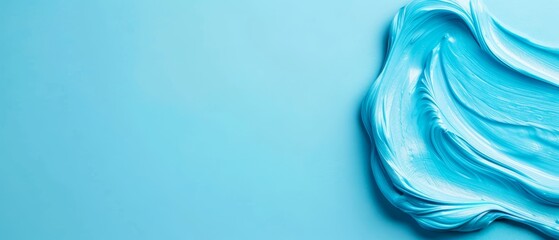 Wall Mural -  A tight shot of a blue cake against a blue backdrop White icing covers the cake, adorned with a single swirl at its center