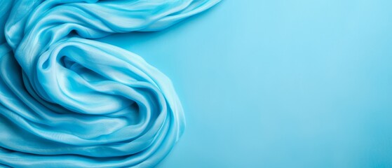 Wall Mural -  A tight shot of a blue fabric against a light blue backdrop, ideal for text or image insertion