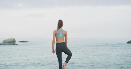 Canvas Print - Fitness, yoga and back woman at a beach for energy, training or mental health wellness on sky background. Freedom, zen and rear view of female person with balance, breathing or holistic meditation