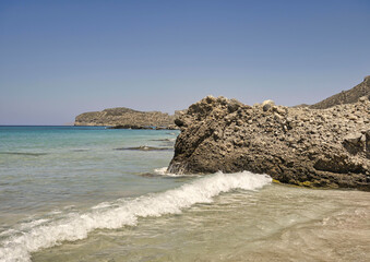 Landscape with waves hitting rocky coast of Mediterranean Sea