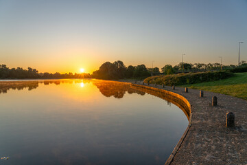 Wall Mural - Caldecotte lake at sunrise in Milton Keynes. England