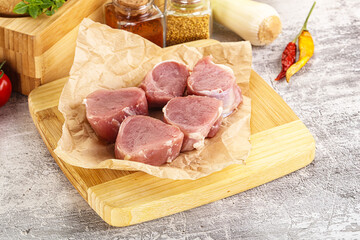 Sticker - Uncooked raw pork tenderloin medallions