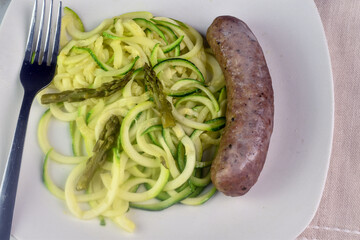 Wall Mural - zucchini noodles  top with asparagus  with  itian sausage