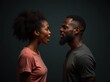© useful pictures - Angry young adult african american woman yelling versus her husband. Black man and woman shouting at each other over dark studio background. Relationship crisis and family conflict concept