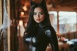 © Dmitrii - A woman in a black cat costume poses inside a rustic cabin decorated for Halloween