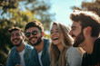 © Steven - Group of young friends enjoying a sunny day outdoors, with a happy and relaxed atmosphere. The friends are laughing and enjoying each other's company.