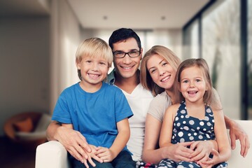 Poster - Happy young family relaxing at home