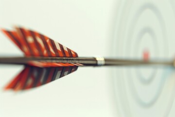 Wall Mural - A close-up shot of an arrow embedded in a target, with a focus on the arrow's tip and the surrounding details