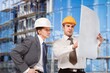 © BillionPhotos.com - Two engineer working at construction site building project,