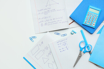 Wall Mural - Copybooks with math formulas and different stationery on light table