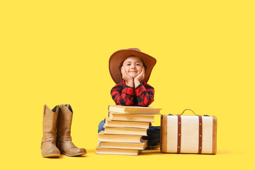 Sticker - Cute little cowboy with books and boots on yellow background