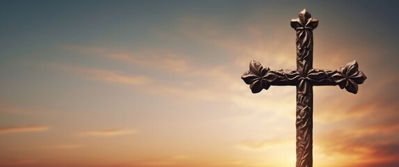 Ornate Wooden Cross Silhouetted Against a Sunset Sky