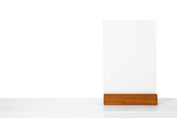 Wall Mural - Menu holder on light wooden table against white background. Space for text