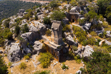 Canvas Print - Rock tombs, tombstones and sarcophagi on a mountainside near the ancient city of Sura. Turkey