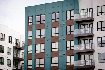 Exterior view of modern apartment building. New construction apartment or condo complex. Modern new residential apartment house building complex