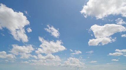 Wall Mural - Time lapse of clear blue sky with white fluffy clouds at noon. Day time. Abstract nature landscape background.