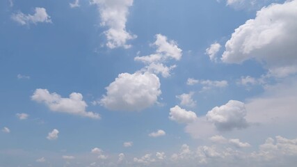 Wall Mural - Time lapse of clear blue sky with white fluffy clouds at noon. Day time. Abstract nature landscape background.