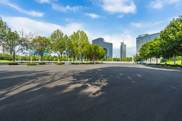 Wall Mural - empty asphalt floor with city skyline