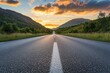 © DailyStock - Sunset Over Mountains with Empty Asphalt Road. Green Hills Landscape Background