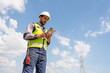 © kelvn - Young mechanical engineer working and holding tablet to checking and inspection new construction project of industrial.