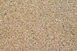 © DwiwantoIndrayu - Smooth surface structure of beach sand, beach sand texture background.
