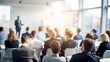 © Mari - Blurry Business Seminar Room - Out-of-focus background of a business seminar room with participants and equipment.