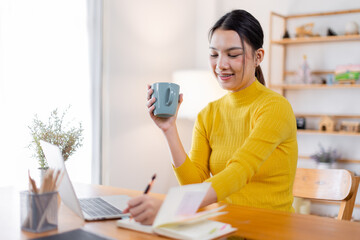 Beautiful young freelancer asian woman working indoors,  Entrepreneur and freelancer people concept.