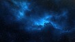 © daratorn - Blue Space Nebula. A deep space scene featuring a glowing blue nebula with stars scattered across the background.