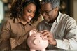 © Yuliia - Saving for Retirement: African American Using Piggy Bank